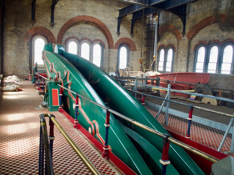 A decorated green beam, with the far end raised up in the air.